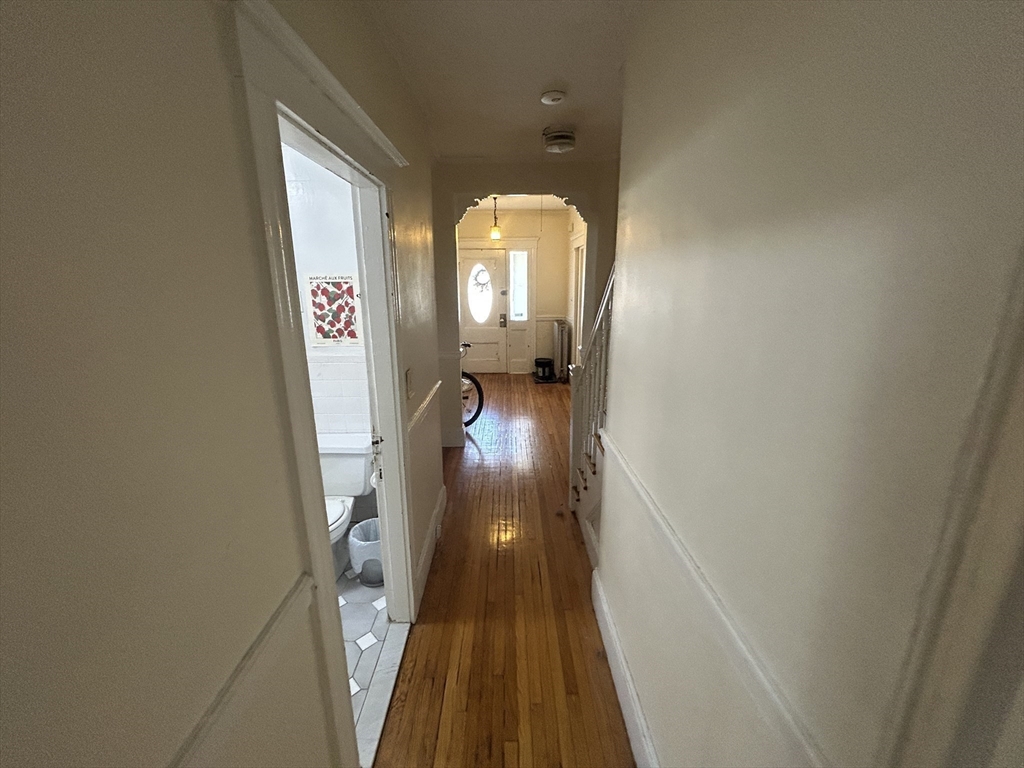 28 Sunset Road, Unit 1 Somerville, MA 02144 - Photo 7 of 15 a view of gallery with wooden floor
