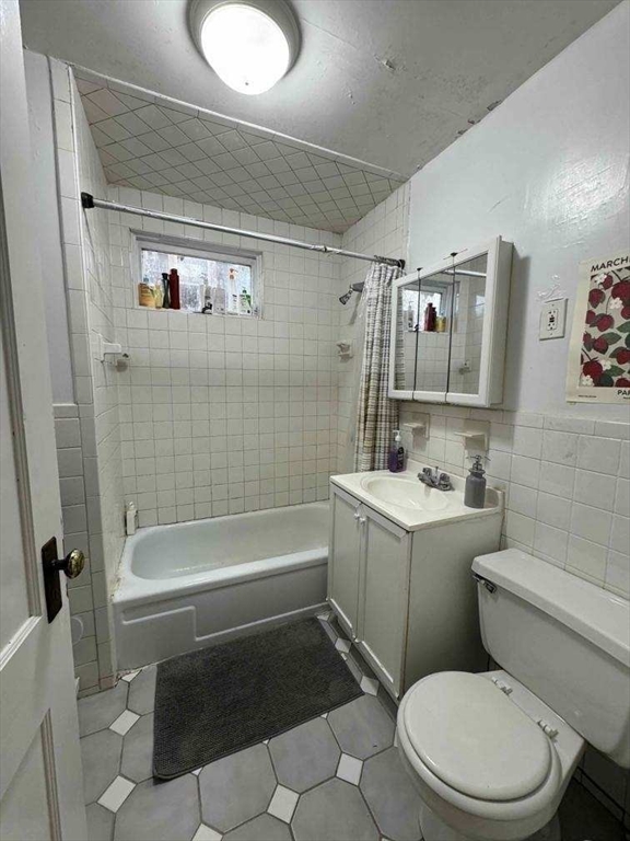 28 Sunset Road, Unit 1 Somerville, MA 02144 - Photo 8 of 15 a bathroom with a sink toilet and shower