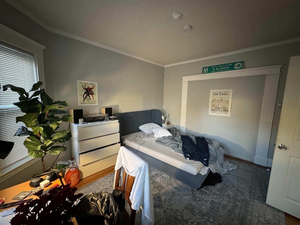 28 Sunset Road, Unit 1 Somerville, MA 02144 - Photo 9 of 15 a bedroom with furniture and a window