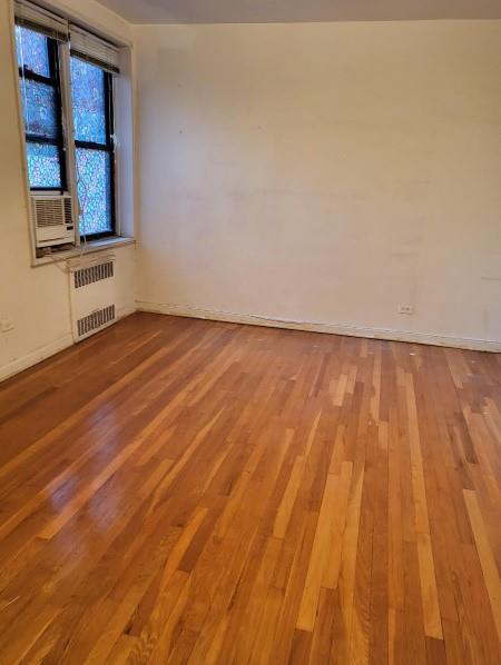37-30 83rd Street, Unit 2M Queens, NY 11372 - Photo 11 of 20 a view of an empty room and window