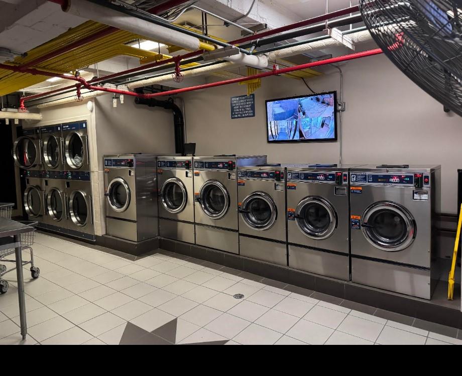 37-30 83rd Street, Unit 2M Queens, NY 11372 - Photo 4 of 20 a utility room with dryer and washer