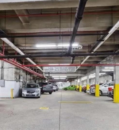 37-30 83rd Street, Unit 2M Queens, NY 11372 - Photo 6 of 20 a view of parking garage with cars