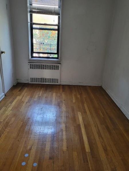 37-30 83rd Street, Unit 2M Queens, NY 11372 - Photo 10 of 20 a view of a room with wooden floors and window