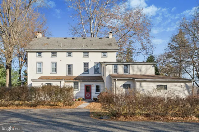 a view of a building with a yard