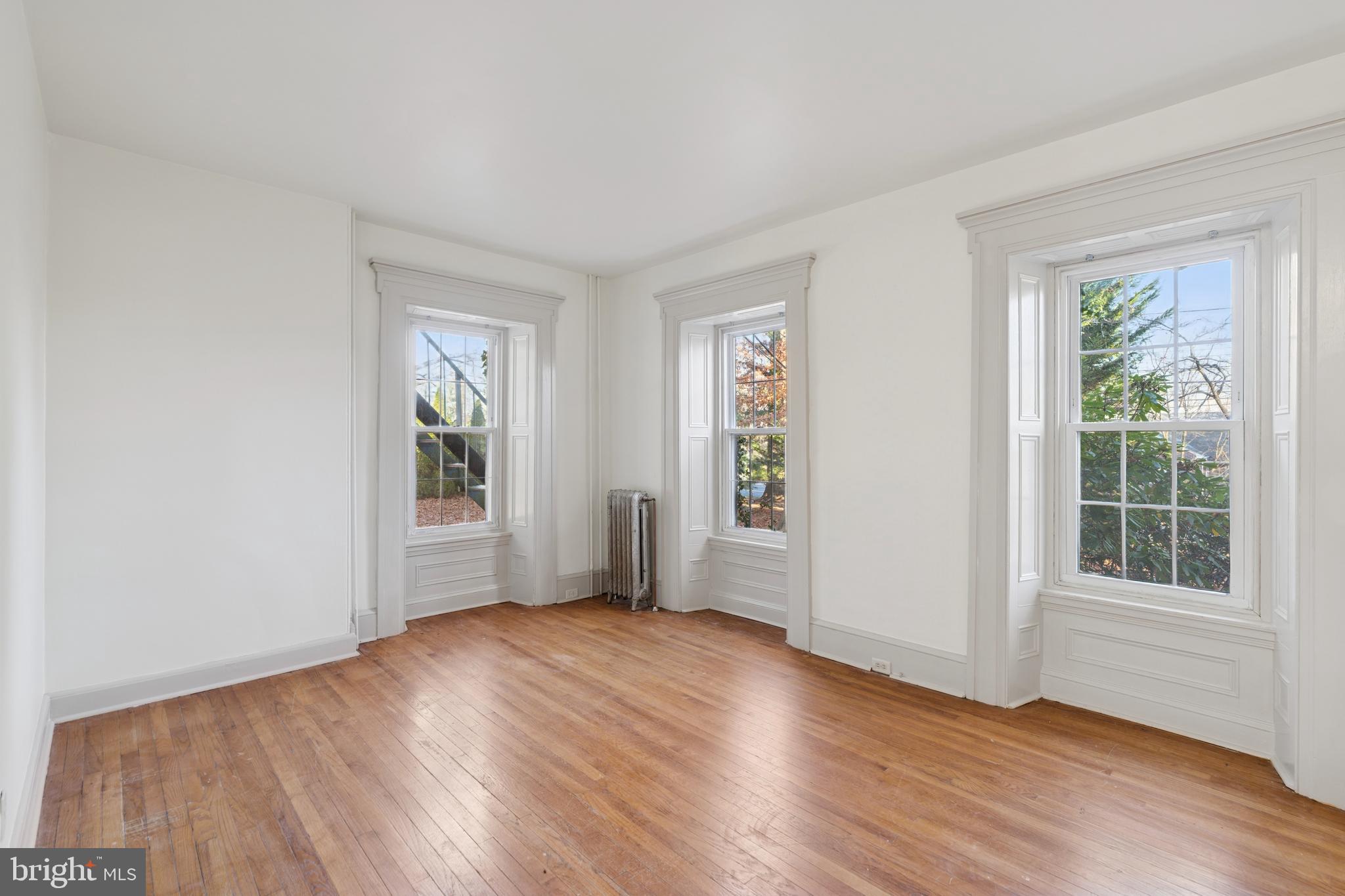 1138 East Schuylkill Road, Unit 2 Pottstown, PA 19465 - Photo 2 of 14 an empty room with wooden floor and windows