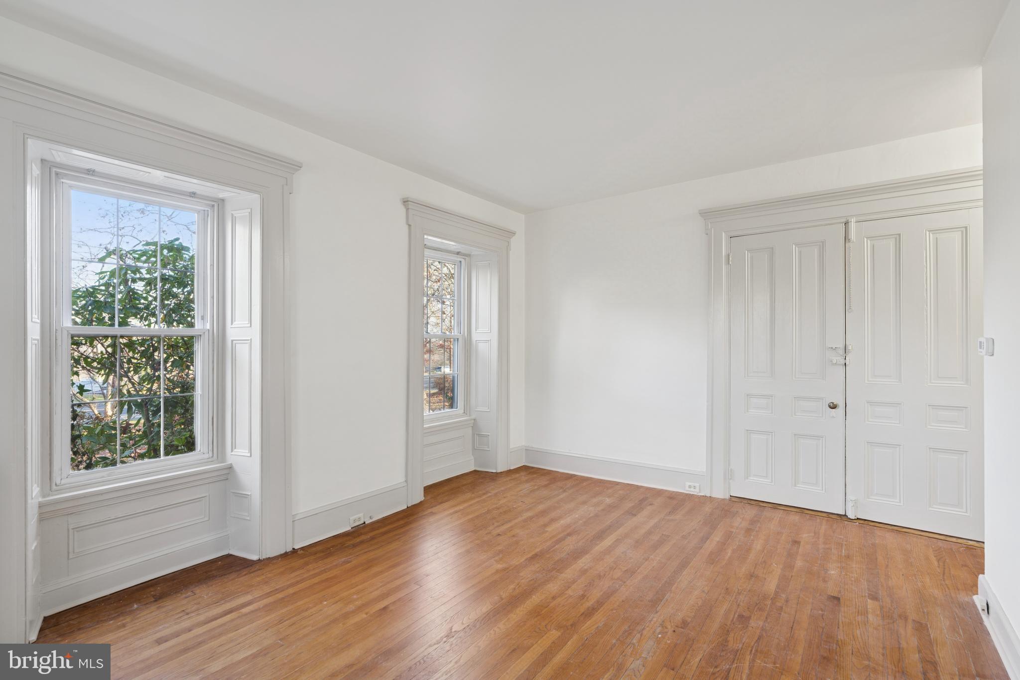 1138 East Schuylkill Road, Unit 2 Pottstown, PA 19465 - Photo 3 of 14 a view of an empty room with wooden floor and a window