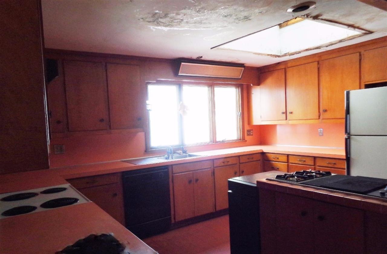 45 Uplands Drive Wellfleet, MA 02667 - Photo 11 of 35 a kitchen with stainless steel appliances granite countertop a sink stove and refrigerator
