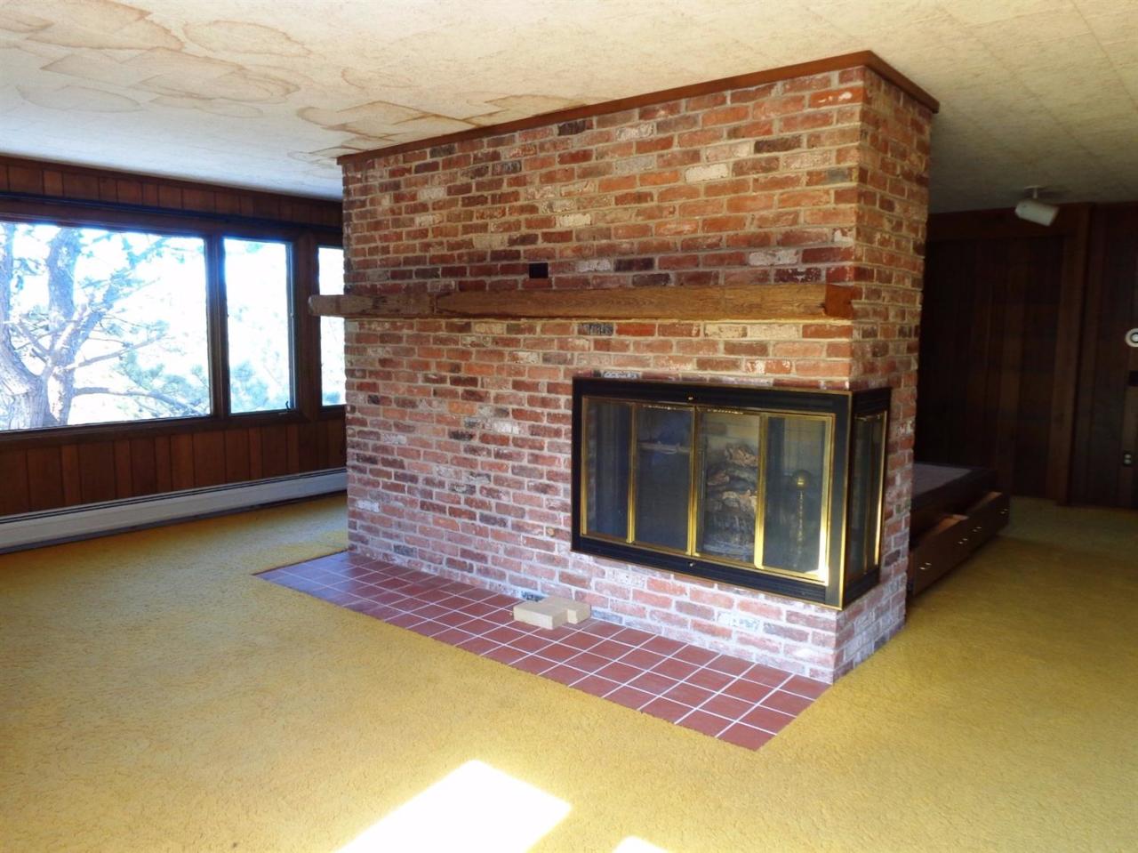 45 Uplands Drive Wellfleet, MA 02667 - Photo 22 of 35 a living room with a fireplace