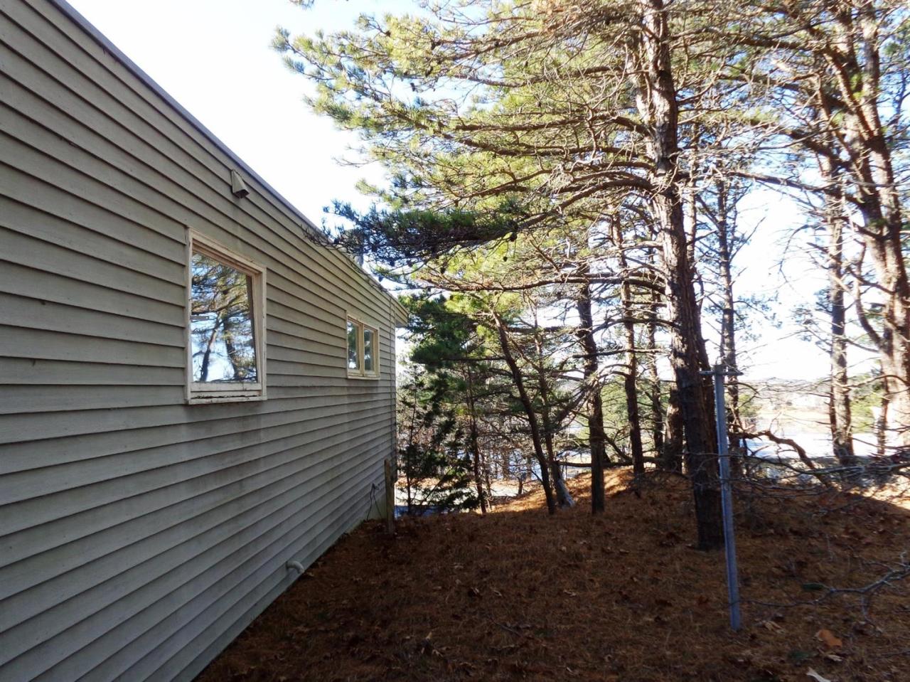 45 Uplands Drive Wellfleet, MA 02667 - Photo 3 of 35 a backyard of a house with lots of green space