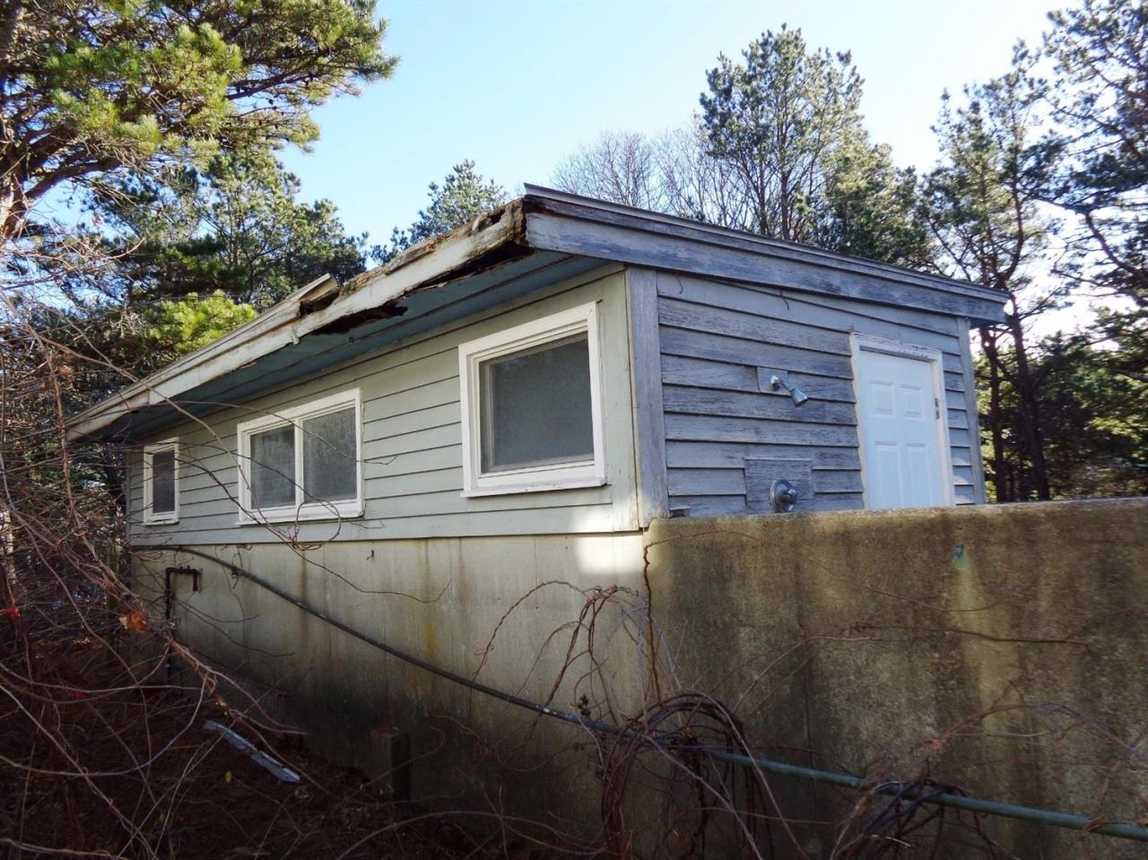 45 Uplands Drive Wellfleet, MA 02667 - Photo 4 of 35 a backyard of a house