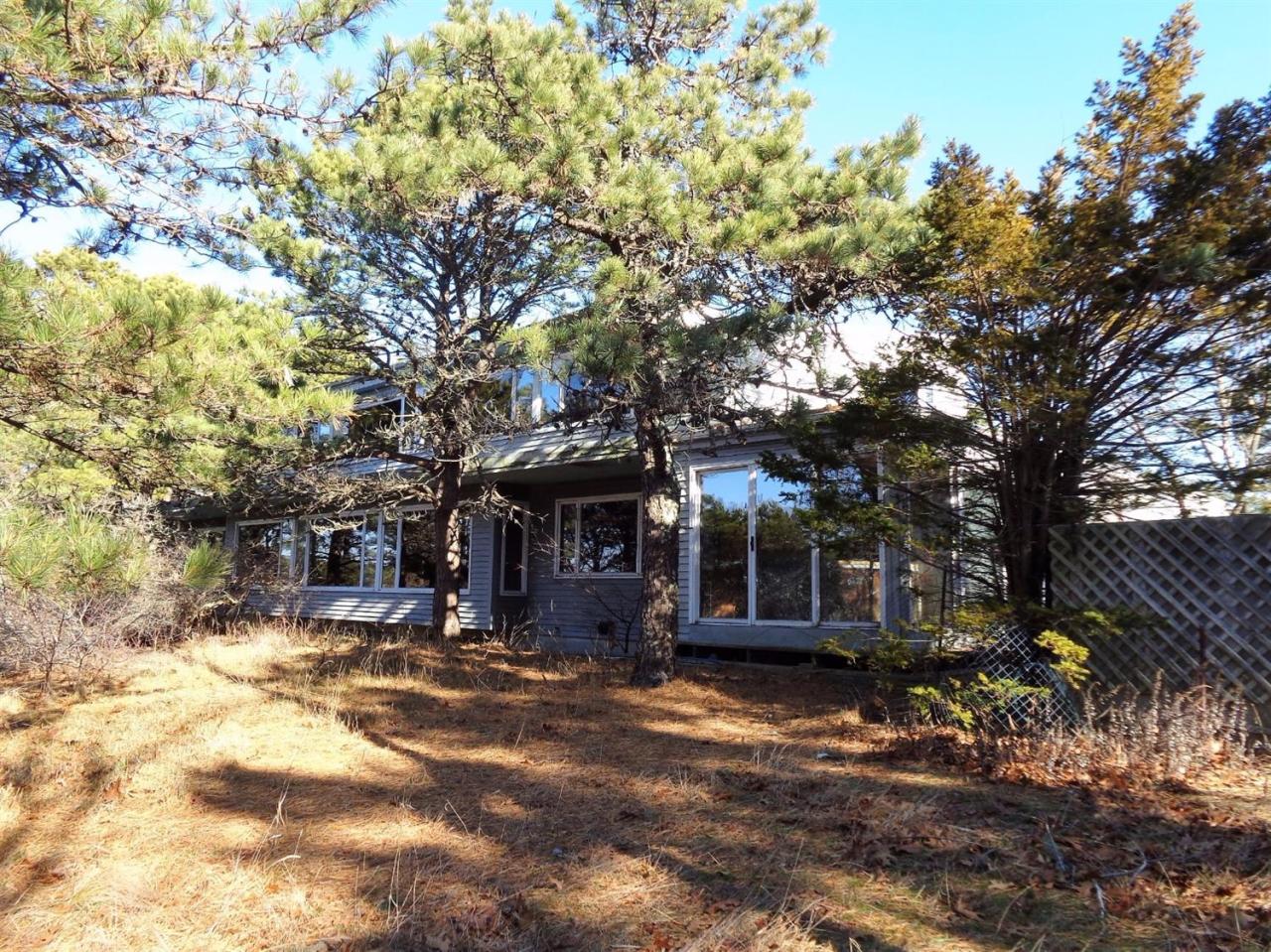 45 Uplands Drive Wellfleet, MA 02667 - Photo 5 of 35 a view of a house with a snow in the yard