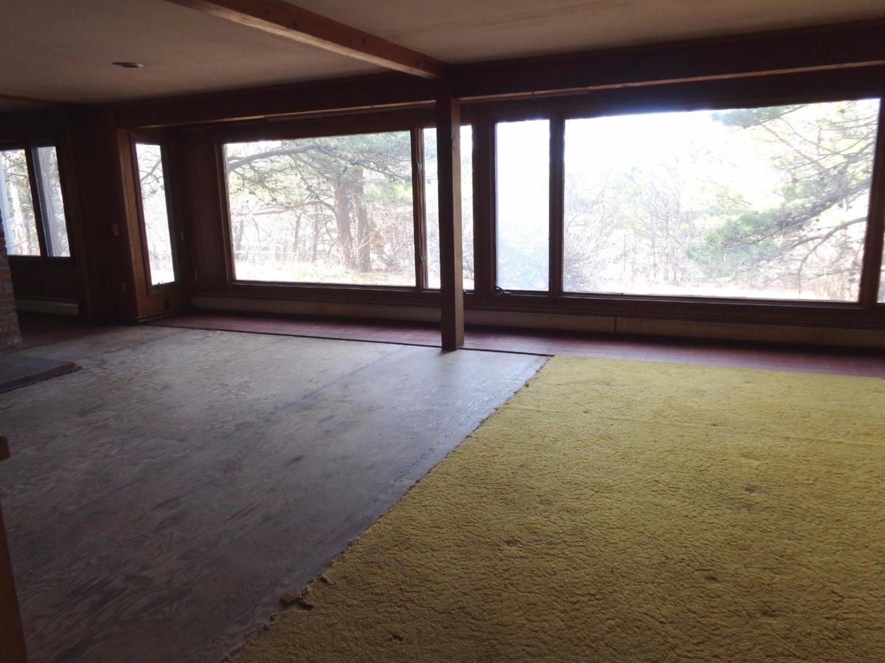 45 Uplands Drive Wellfleet, MA 02667 - Photo 7 of 35 a view of an empty room with a large window