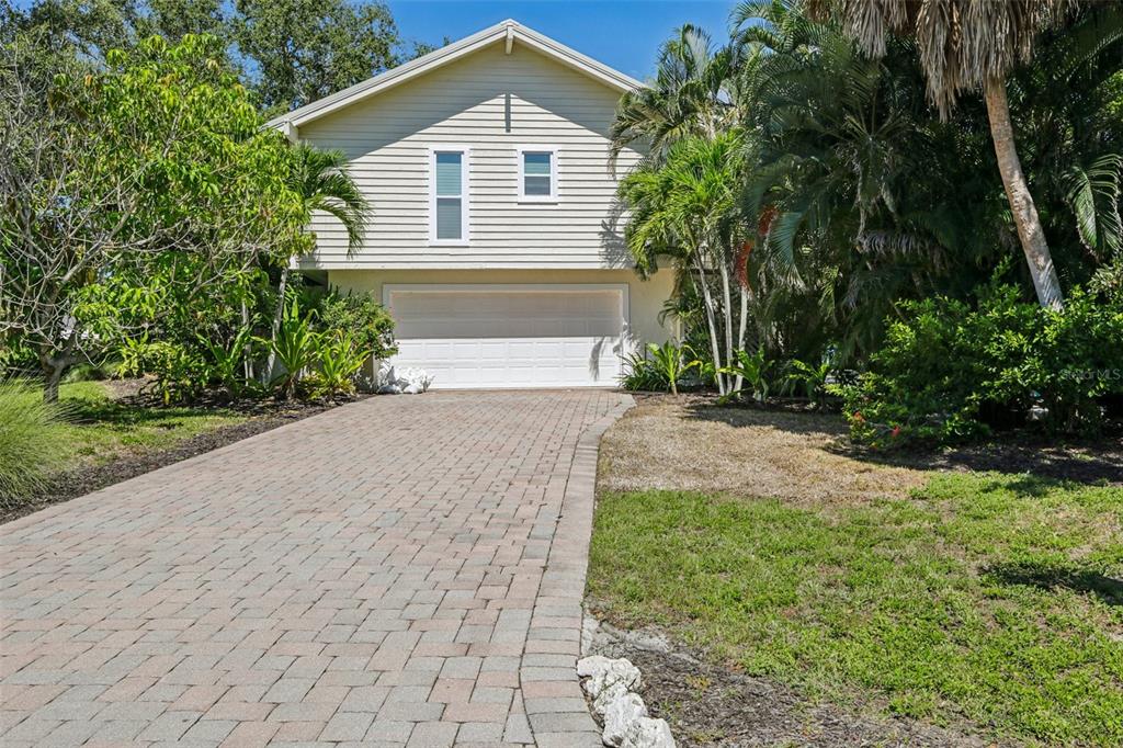 3390 Bayou Sound Longboat Key, FL 34228 - Photo 46 of 59 a front view of a house with a yard