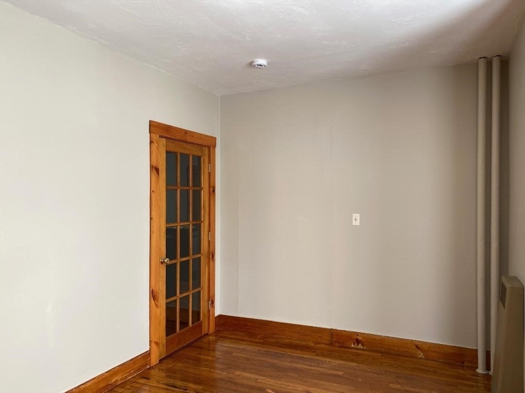 16 Ruggles Street, Unit 1 Westborough, MA 01581 - Photo 14 of 22 a view of empty room with wooden floor