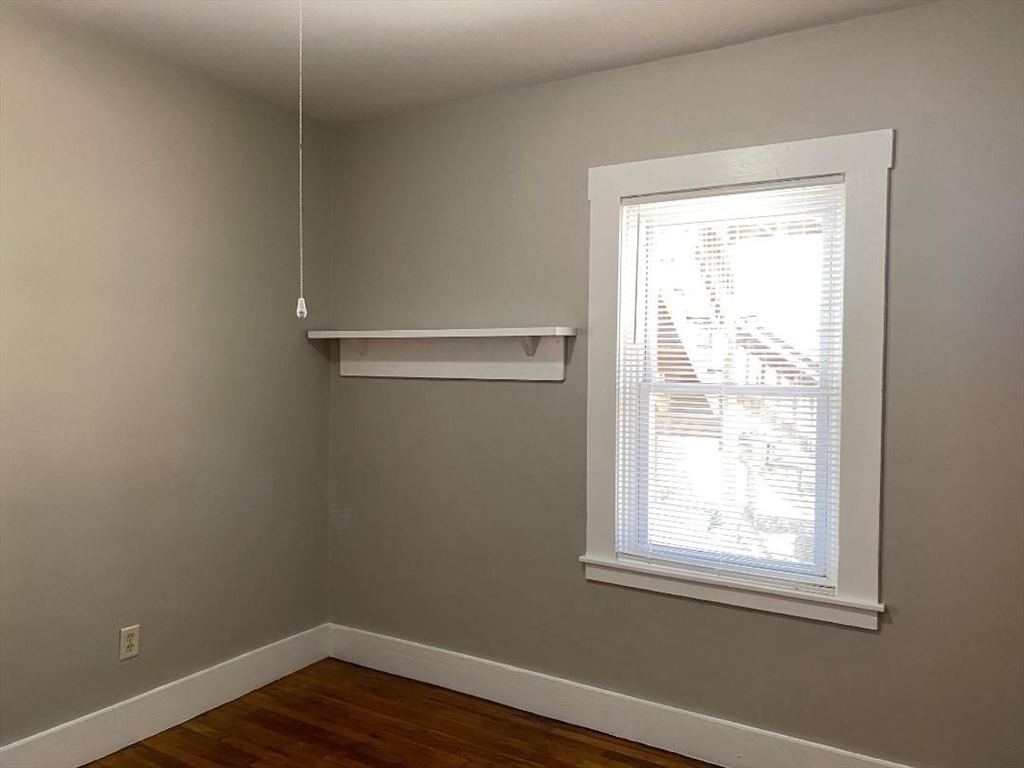 16 Ruggles Street, Unit 1 Westborough, MA 01581 - Photo 15 of 22 a view of a small space with wooden floor and a window