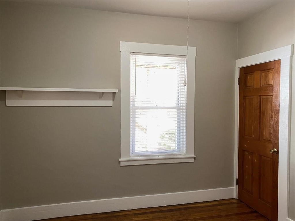 16 Ruggles Street, Unit 1 Westborough, MA 01581 - Photo 16 of 22 a view of a small space with wooden floor and a window