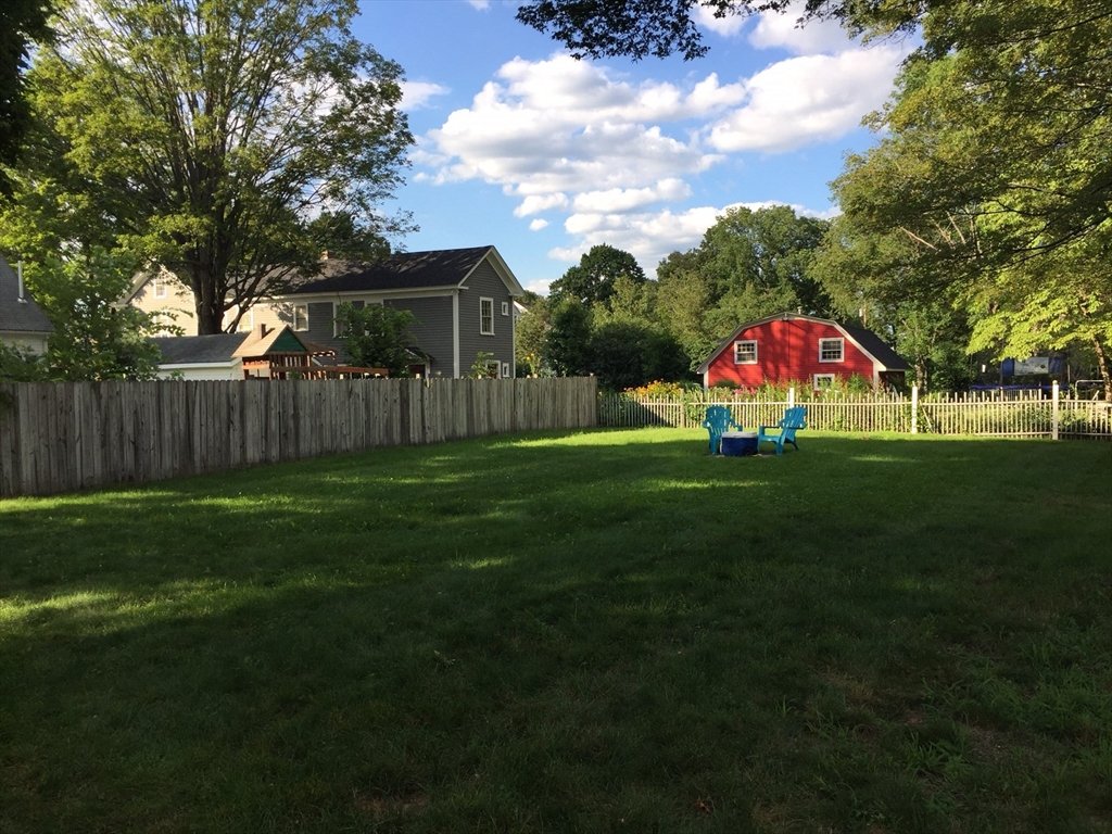 16 Ruggles Street, Unit 1 Westborough, MA 01581 - Photo 22 of 22 a view of yard with swimming pool and green space