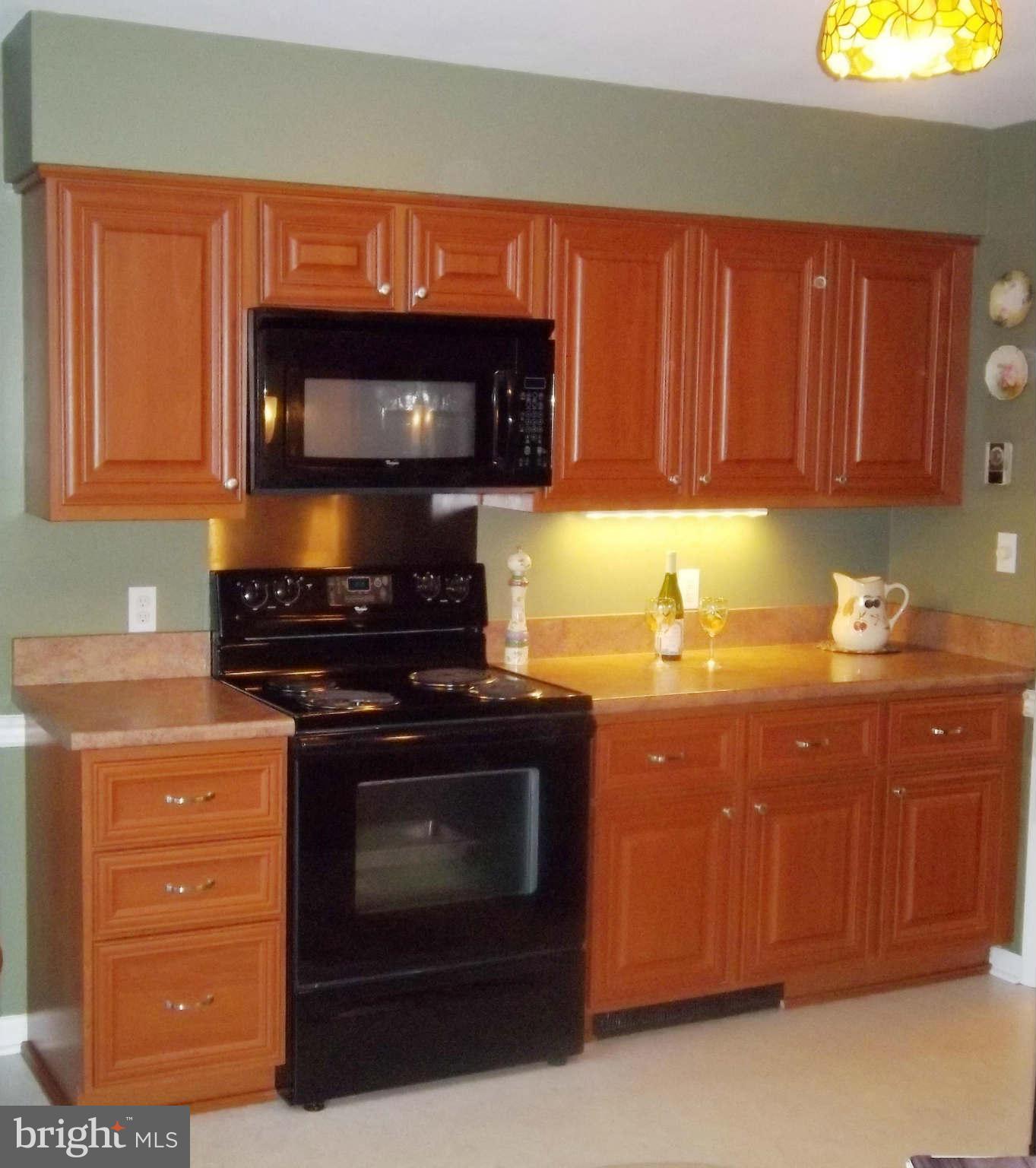 1835 Clear View Road Union Bridge, MD 21791 - Photo 14 of 22 a kitchen with granite countertop a stove top oven a sink and dishwasher