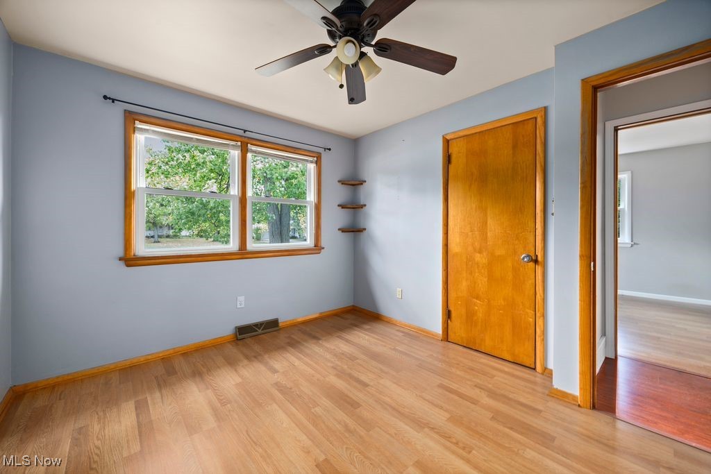 5956 Ryan Road Medina, OH 44256 - Photo 10 of 27 Unfurnished bedroom with ceiling fan, light wood finished floors, and a closet