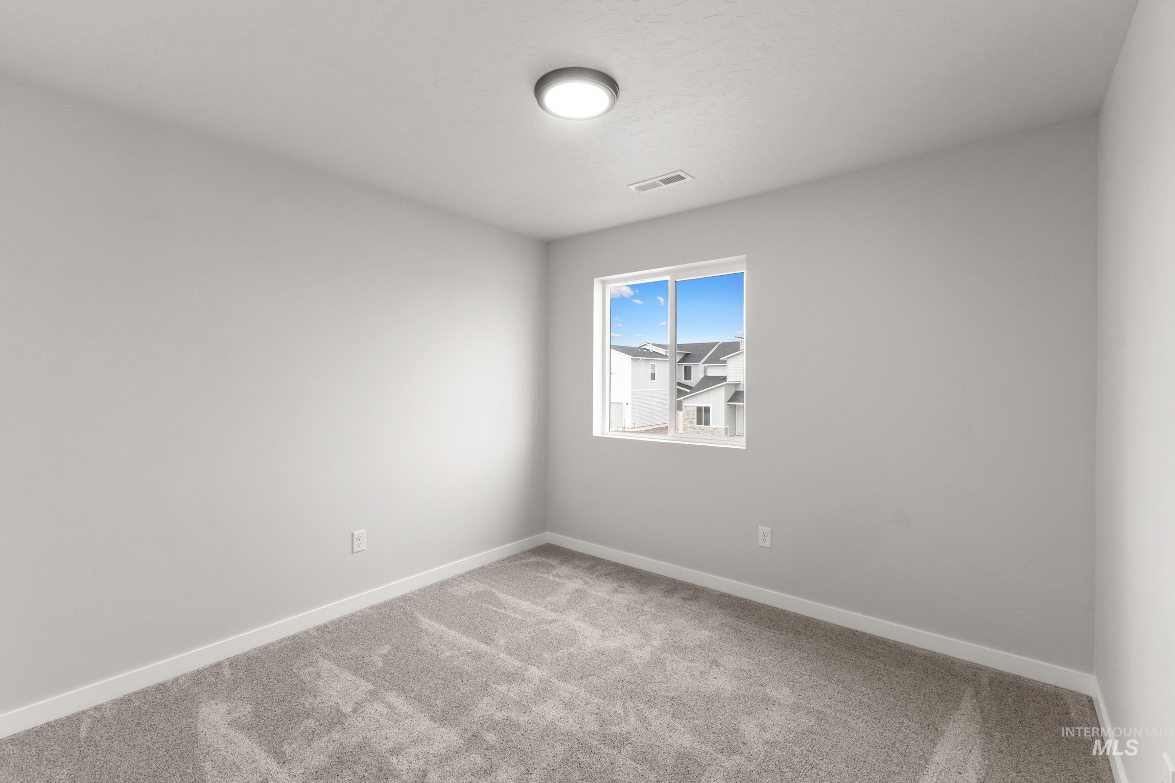 461 Waverly Avenue Middleton, ID 83644 - Photo 13 of 22 Spare room with baseboards and light carpet
