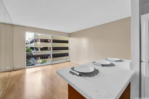 a kitchen with a table and chairs