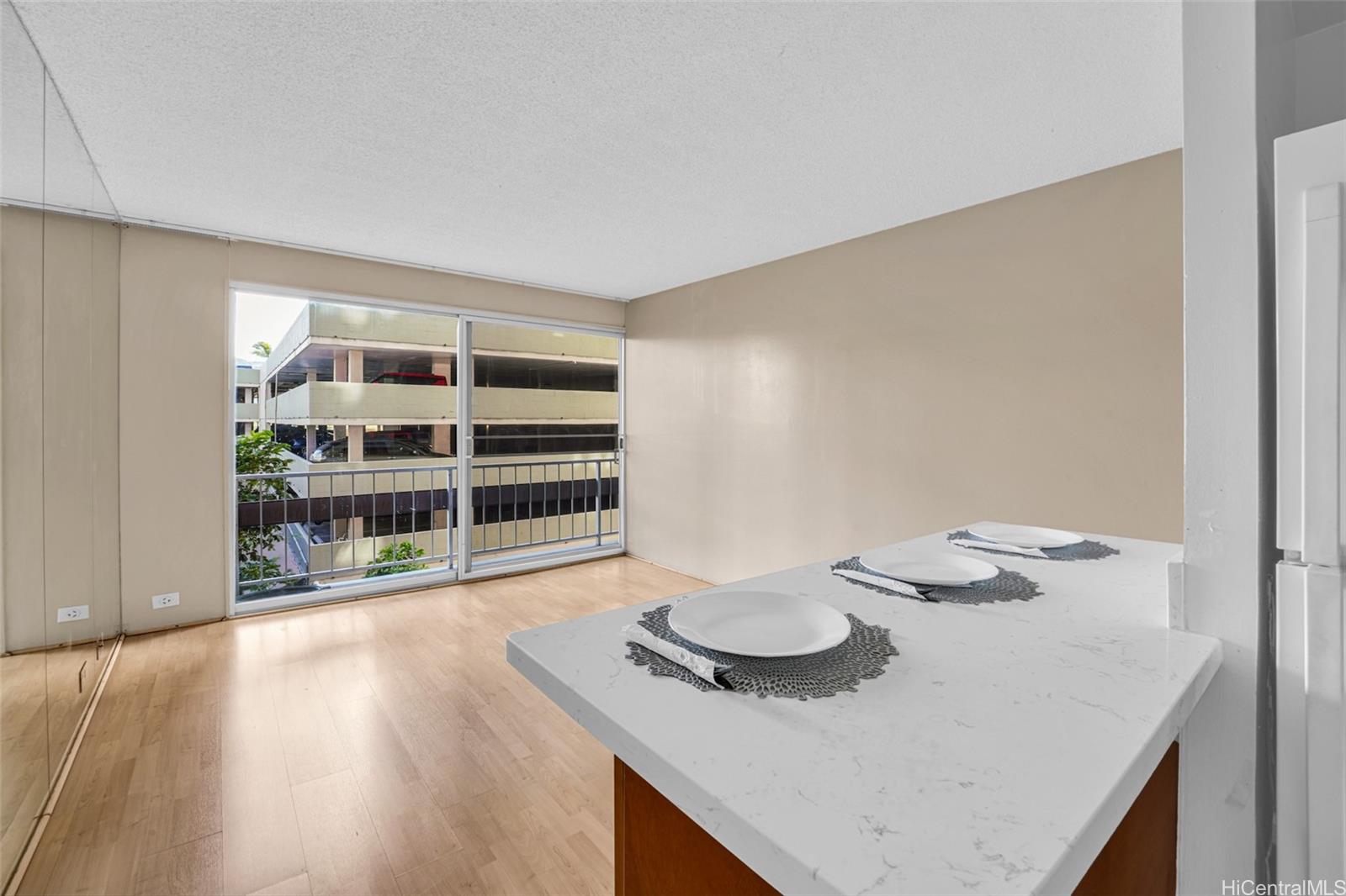 431 Nāhua Street, Unit 309 Honolulu, HI 96815 - Photo 3 of 25 a kitchen with a table and chairs