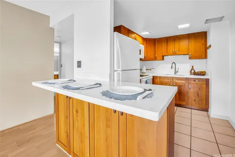 a kitchen with stainless steel appliances a sink stove and refrigerator