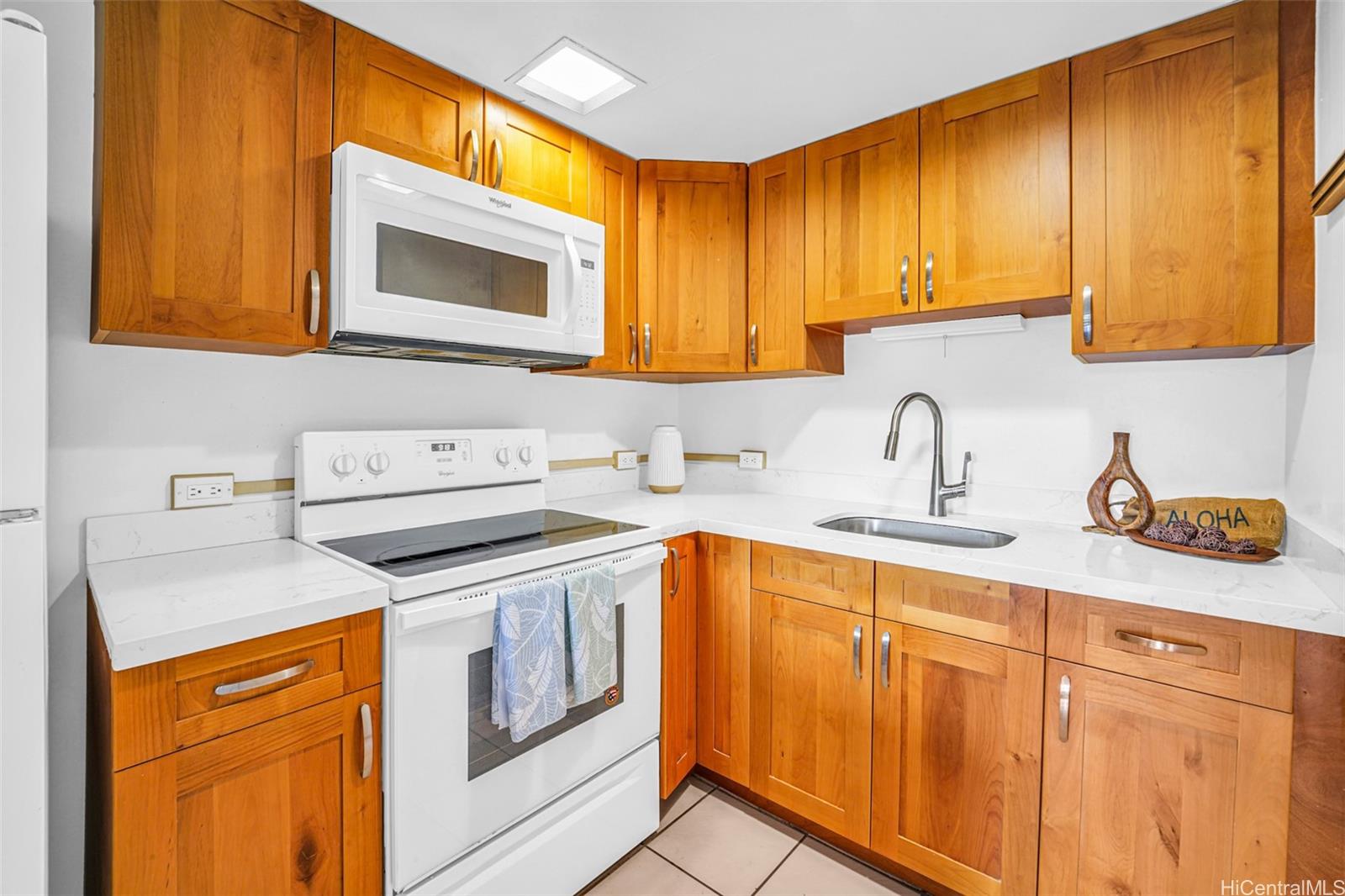 431 Nāhua Street, Unit 309 Honolulu, HI 96815 - Photo 7 of 25 a kitchen with stainless steel appliances granite countertop a sink stove and cabinets