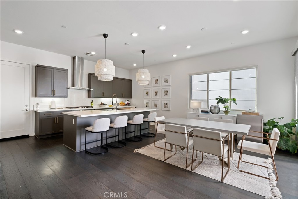 a kitchen with a table and chairs in it