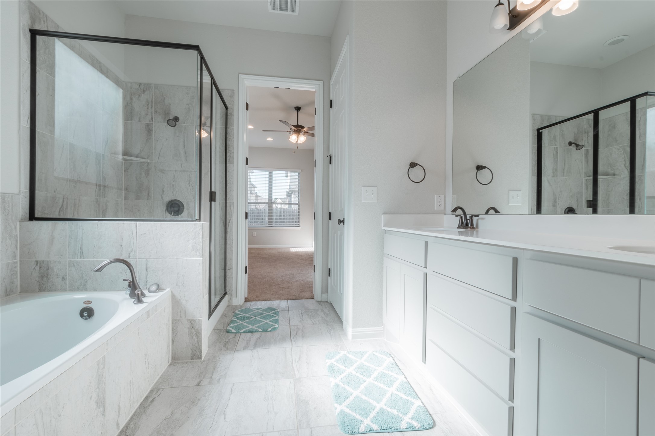 3810 Brushy Creek Road, Unit 77 Cedar Park, TX 78613 - Photo 13 of 33 a bathroom with a bathtub shower and a sink