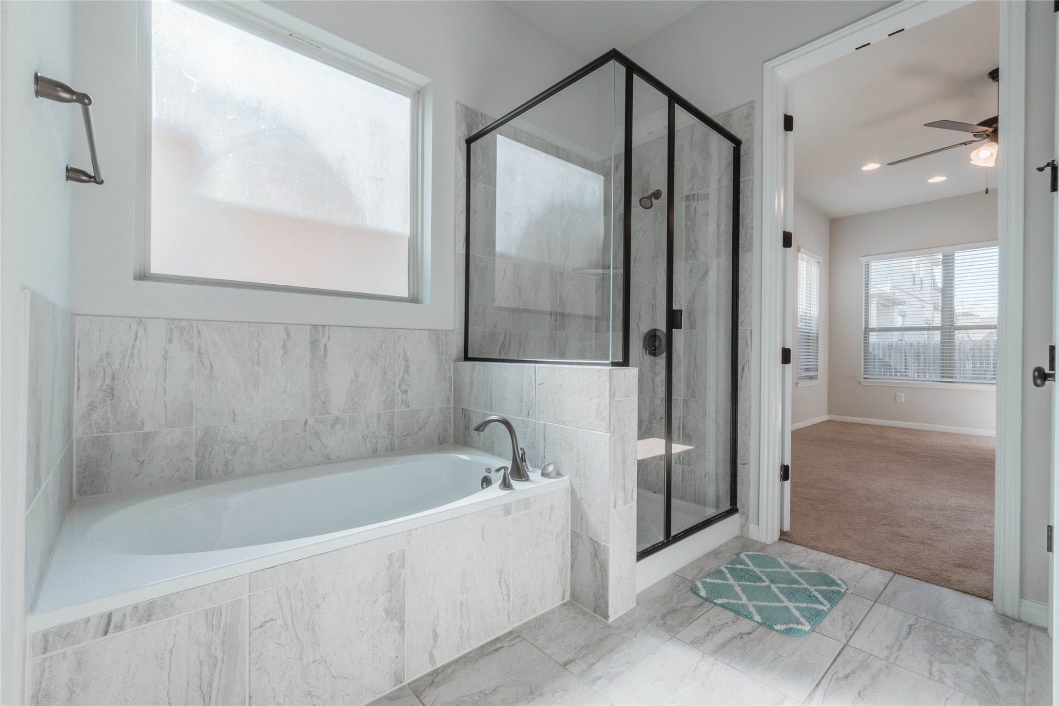 3810 Brushy Creek Road, Unit 77 Cedar Park, TX 78613 - Photo 14 of 33 a bathroom with a bathtub and a shower