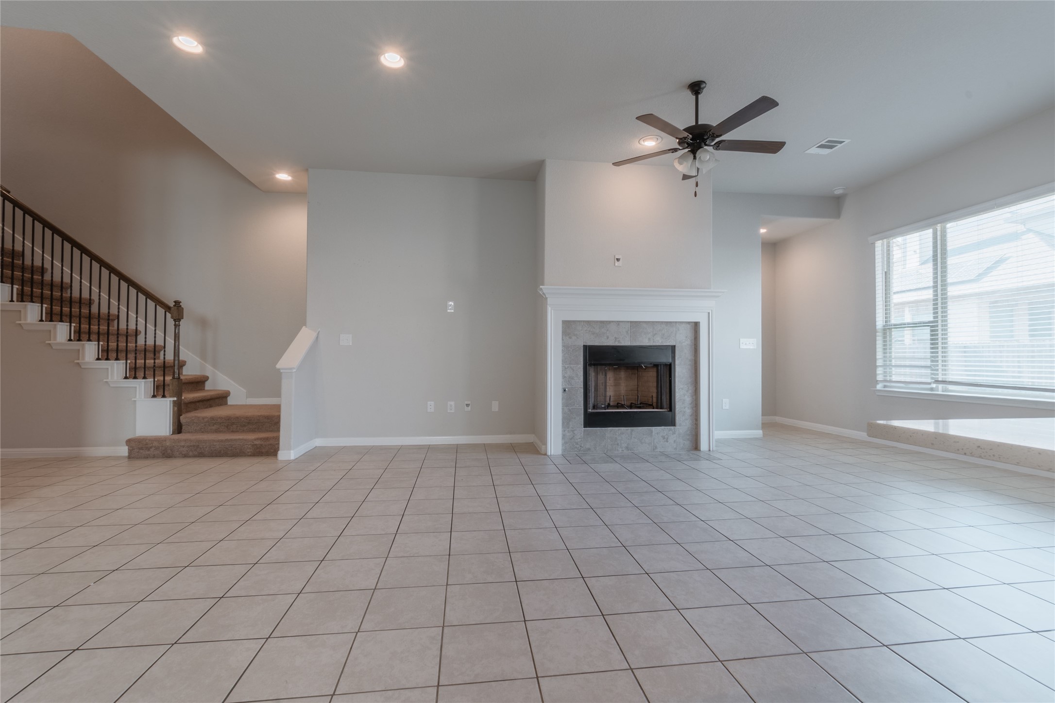 3810 Brushy Creek Road, Unit 77 Cedar Park, TX 78613 - Photo 22 of 33 a view of an empty room with a fireplace and a window