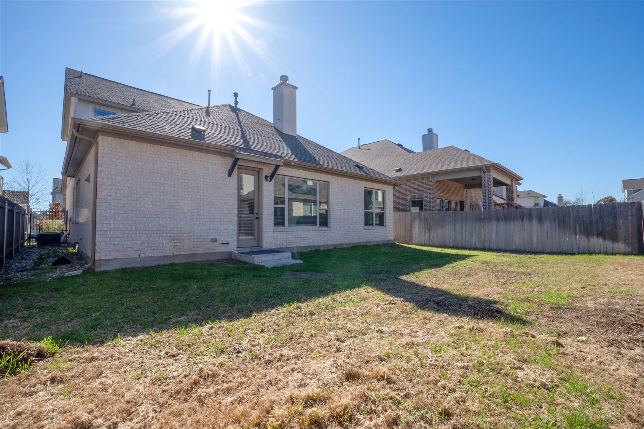3810 Brushy Creek Road, Unit 77 Cedar Park, TX 78613 - Photo 32 of 33 a view of a house with a yard and garage