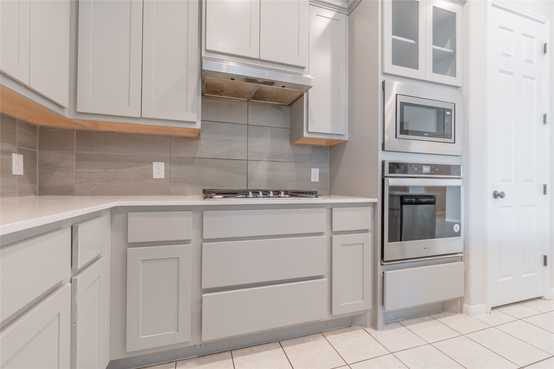 3810 Brushy Creek Road, Unit 77 Cedar Park, TX 78613 - Photo 4 of 33 a kitchen with white cabinets and white appliances