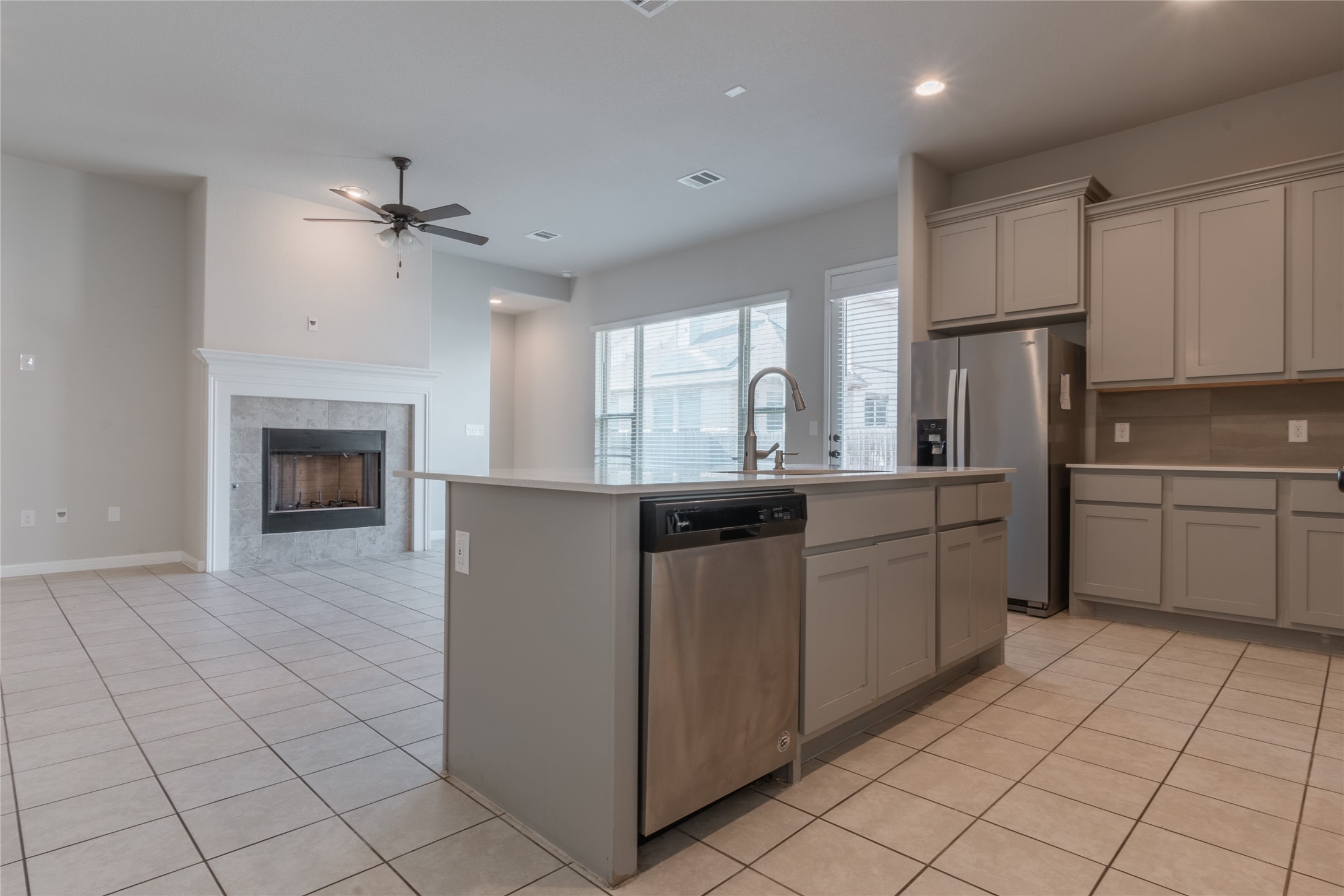 3810 Brushy Creek Road, Unit 77 Cedar Park, TX 78613 - Photo 5 of 33 a kitchen with kitchen island granite countertop a stove a sink and a refrigerator