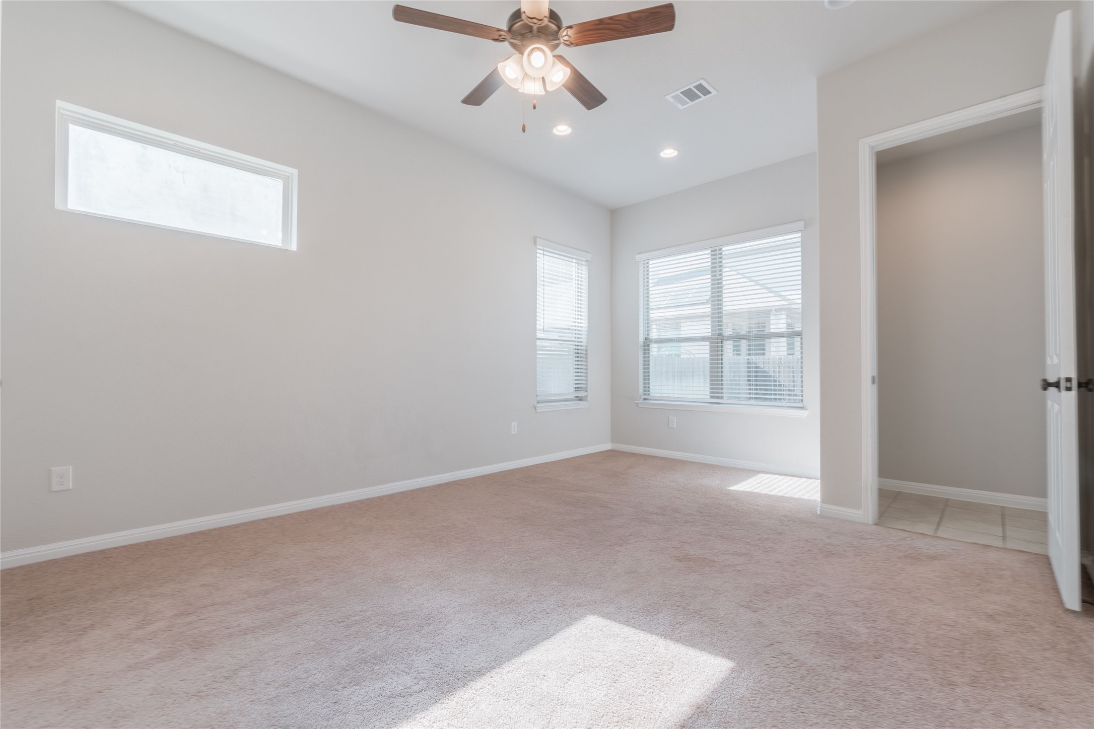 3810 Brushy Creek Road, Unit 77 Cedar Park, TX 78613 - Photo 10 of 33 an empty room with chandelier fan and windows