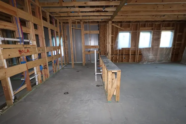 a view of an empty room with windows