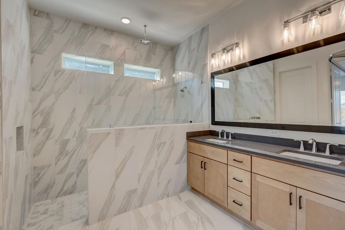 3408 Chestnut Colony Court Conroe, TX 77385 - Photo 5 of 22 a bathroom with a double vanity sink and mirror
