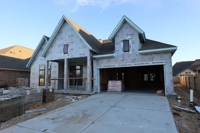 a front view of a house with a garage