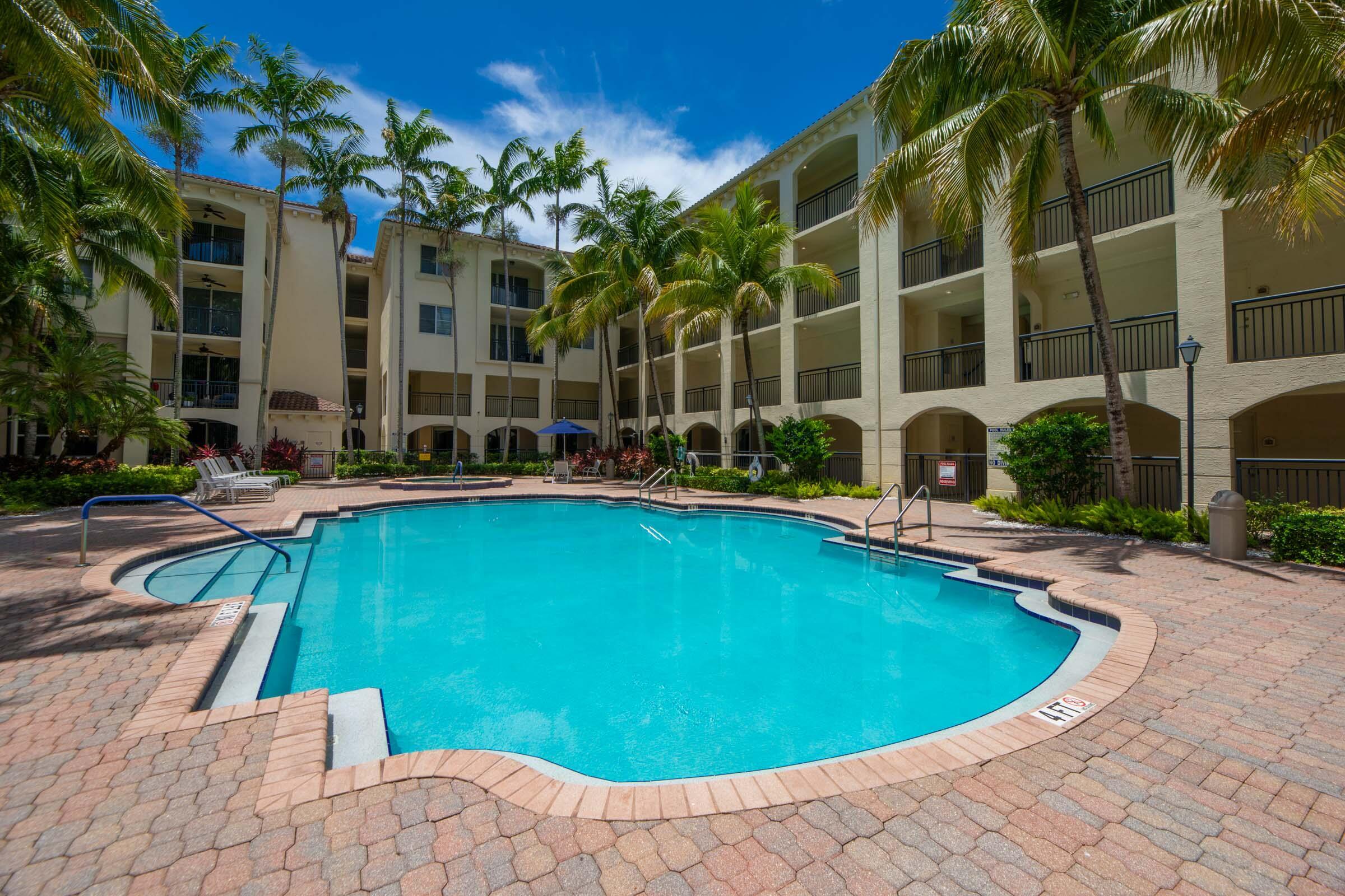 3107 Renaissance Way Boynton Beach, FL 33426 - Photo 31 of 37 a view of a swimming pool with outdoor seating