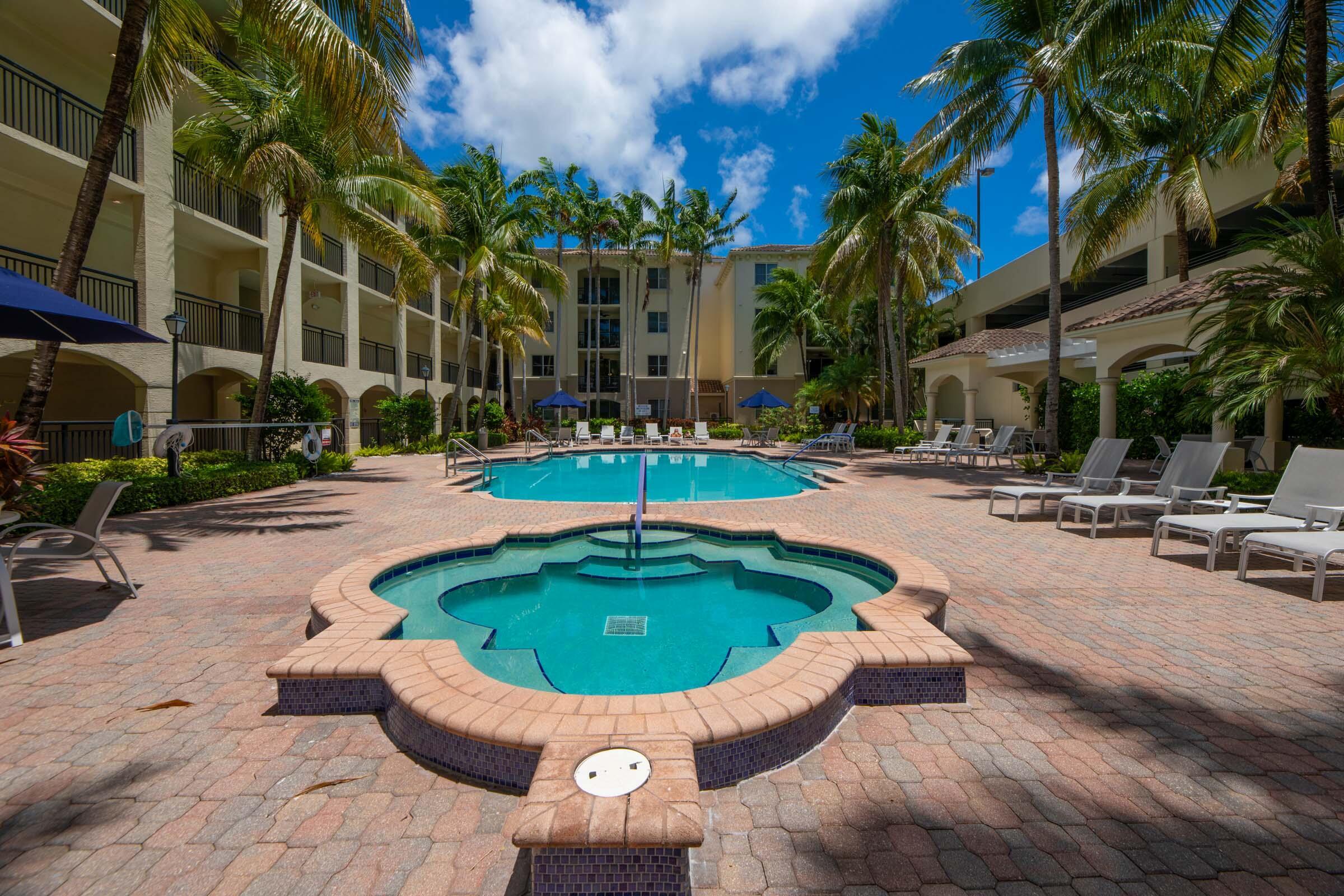 3107 Renaissance Way Boynton Beach, FL 33426 - Photo 32 of 37 a swimming pool with outdoor seating and yard