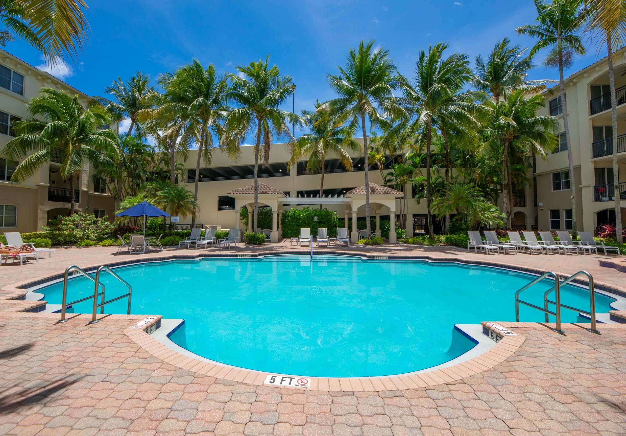 3107 Renaissance Way Boynton Beach, FL 33426 - Photo 33 of 37 a view of a swimming pool with lounge chair