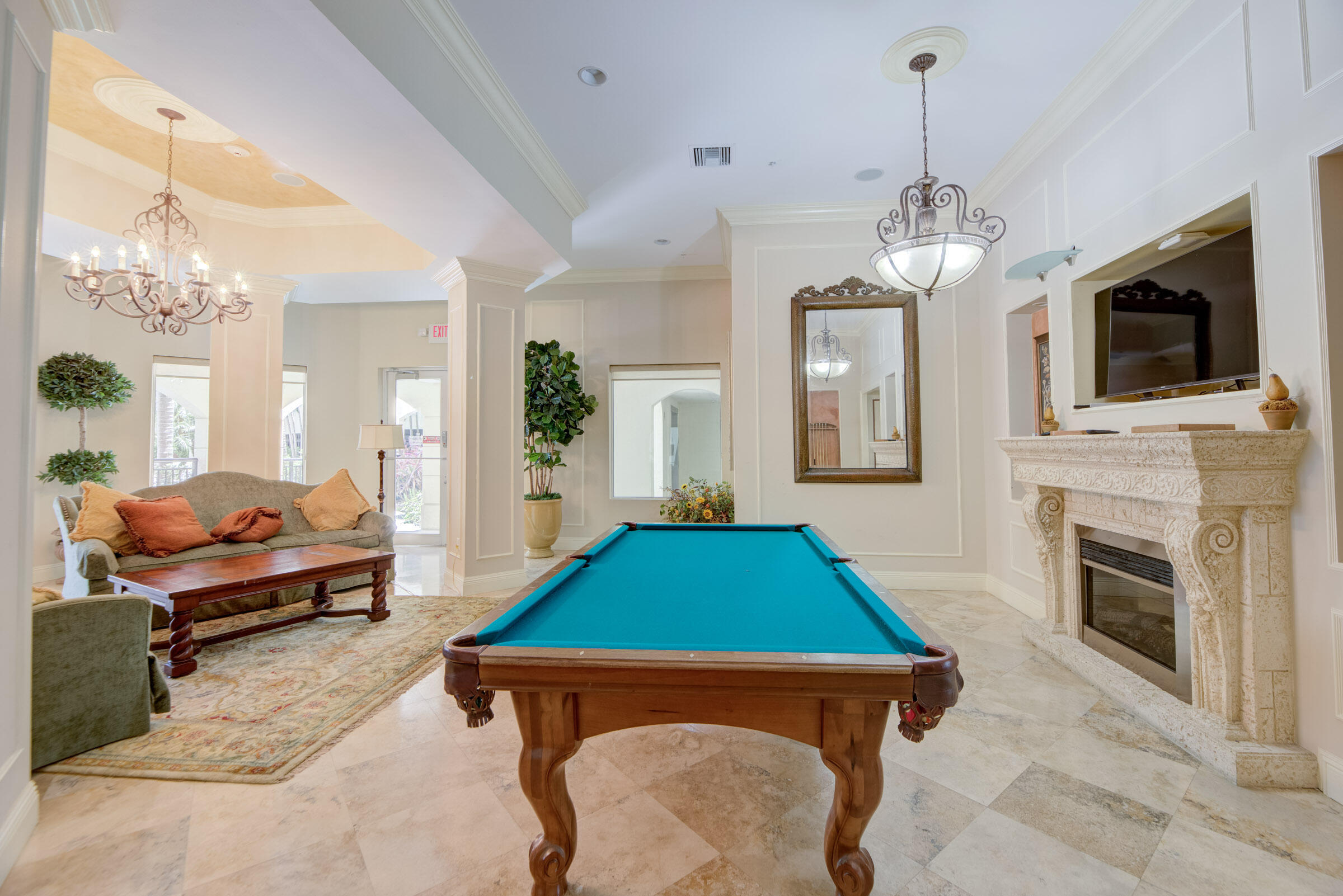 3107 Renaissance Way Boynton Beach, FL 33426 - Photo 36 of 37 a room with furniture fireplace and chandelier