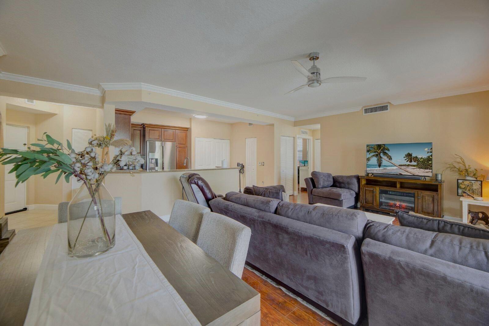 3107 Renaissance Way Boynton Beach, FL 33426 - Photo 7 of 37 a living room with furniture and a potted plant