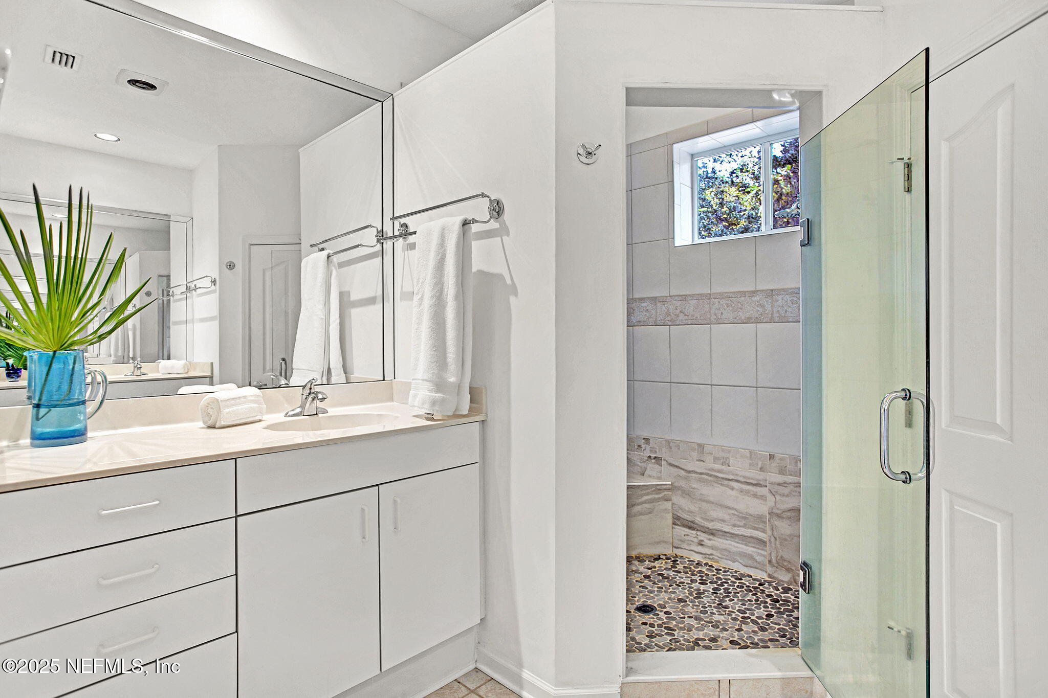 15501 Waterville Road Jacksonville, FL 32226 - Photo 13 of 24 a bathroom with a shower sink and mirror