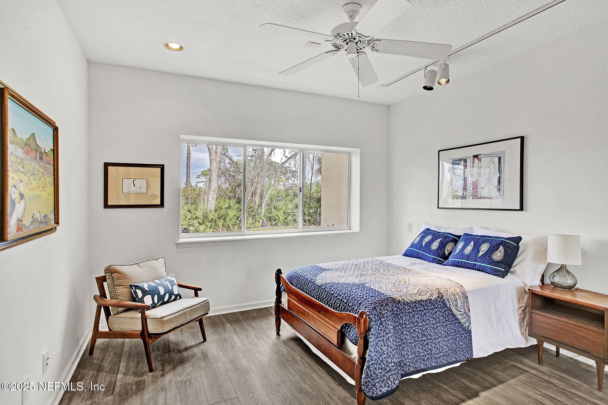 15501 Waterville Road Jacksonville, FL 32226 - Photo 14 of 24 a bedroom with a bed and wooden floor