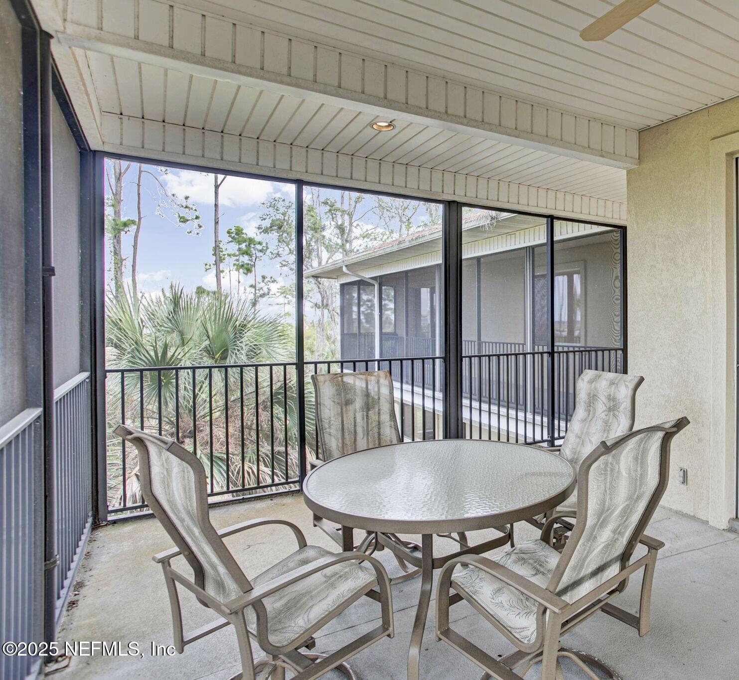 15501 Waterville Road Jacksonville, FL 32226 - Photo 19 of 24 a view of a balcony furniture and dining room