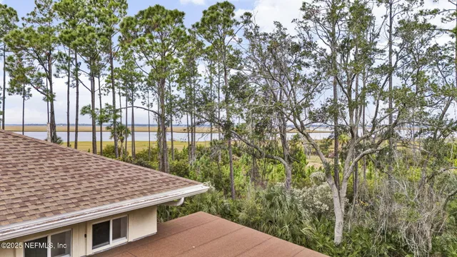 a view of house with tree s