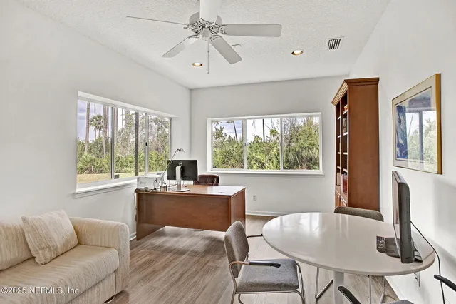 a workspace with furniture and a window