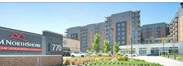 a street sign on a street next to a building